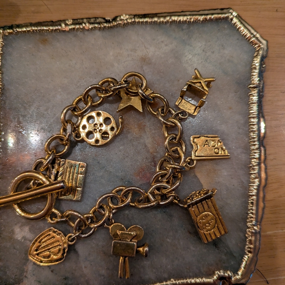 Vintage 1993 Warner Brothers Gold Charm Bracelet with Movie-Themed Charms